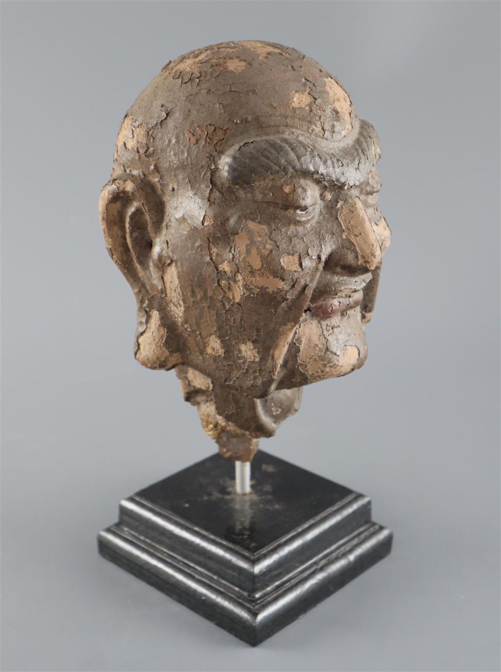 A Chinese clay and wood head of a luohan, possibly Song dynasty, 29cm high